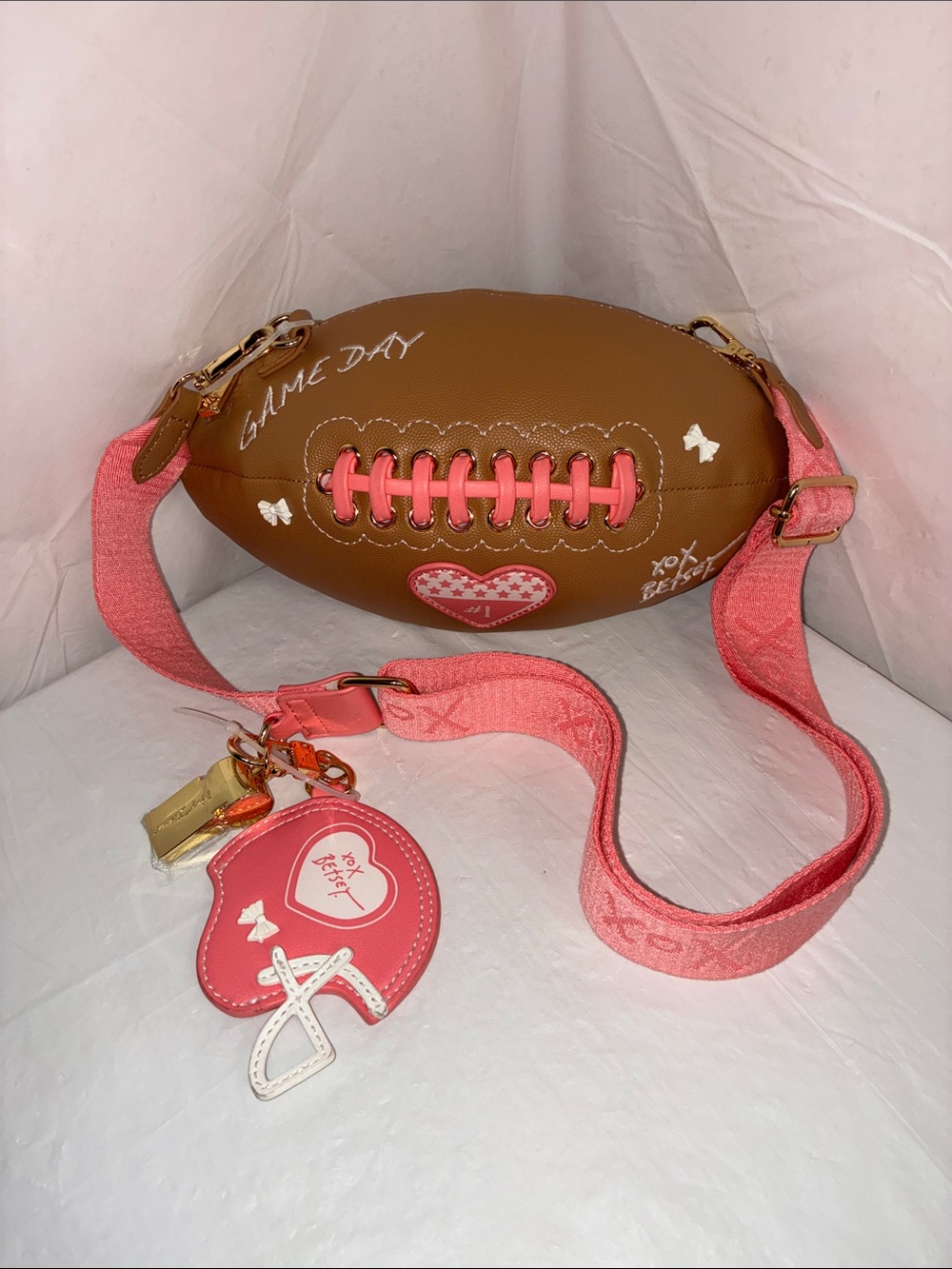 Betsey Johnson Heart Detail Football Crossbody Bag in Brown and Pink